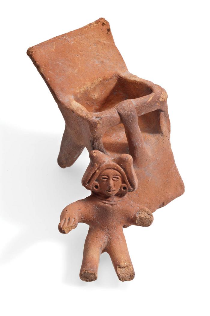 Escultura de barro de infante con periquera