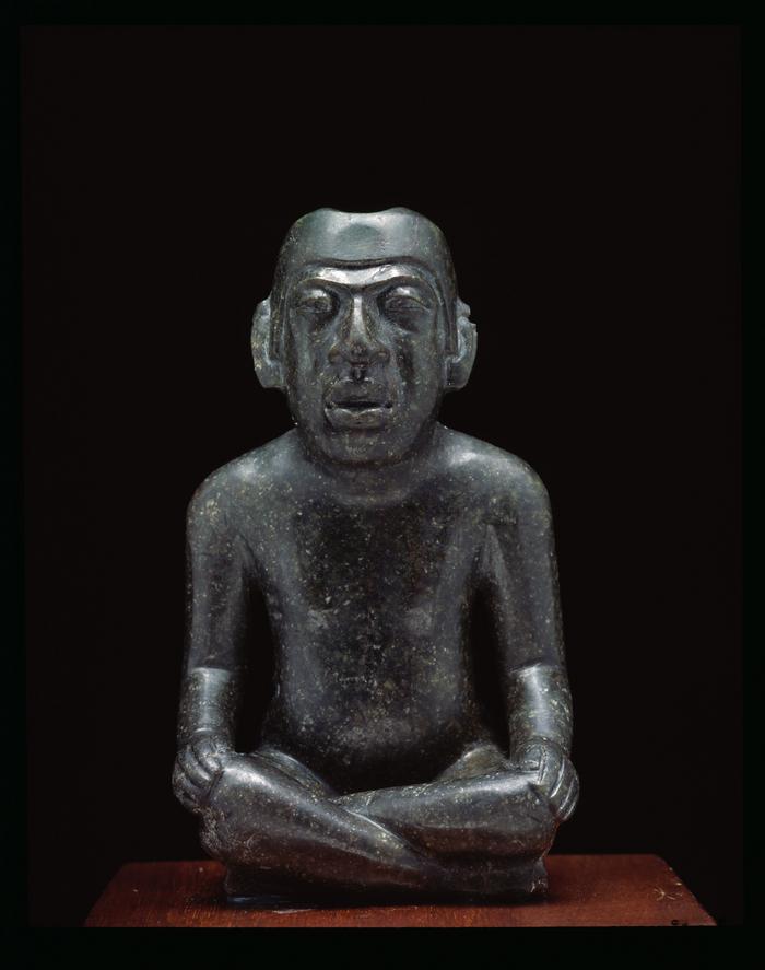 Figura masculina sentada